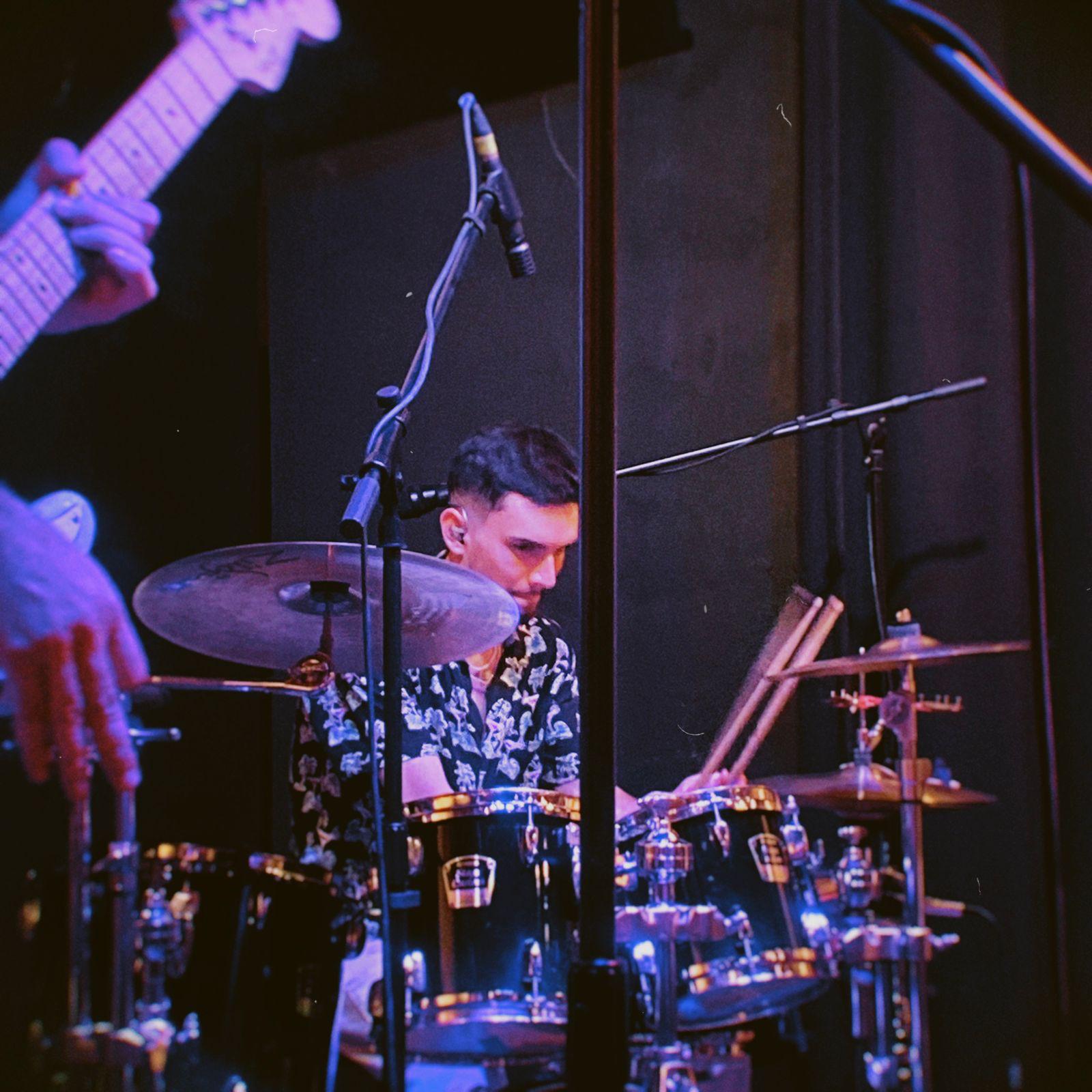 Close-up of a hand on a mixing console.